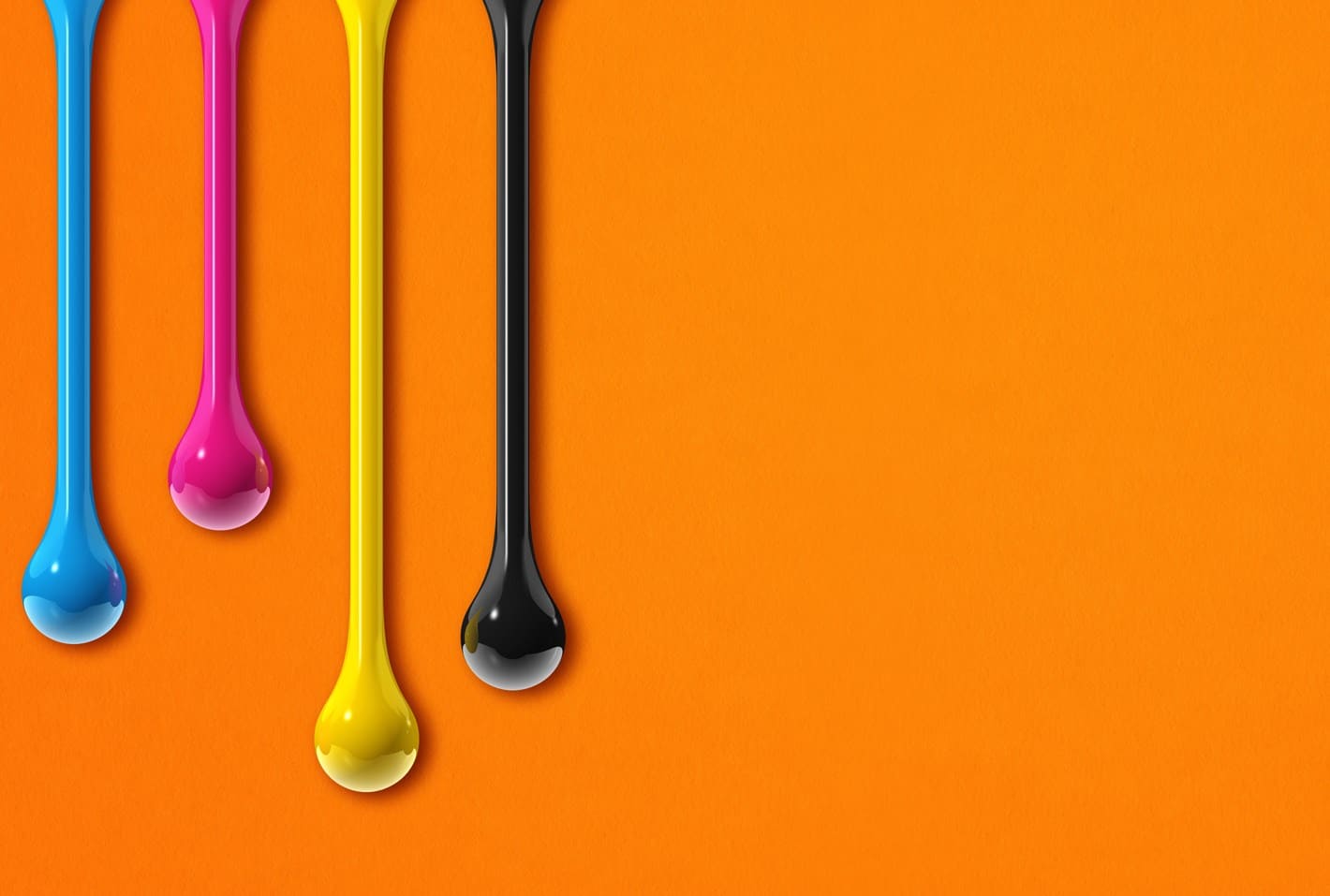 Vivid drips of CMYK colours—cyan, magenta, yellow, and key (black)—on a bright orange background, demonstrating the basic colours used in print design.